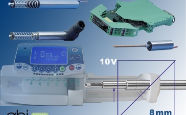 Inductive displacement transducers and buttons