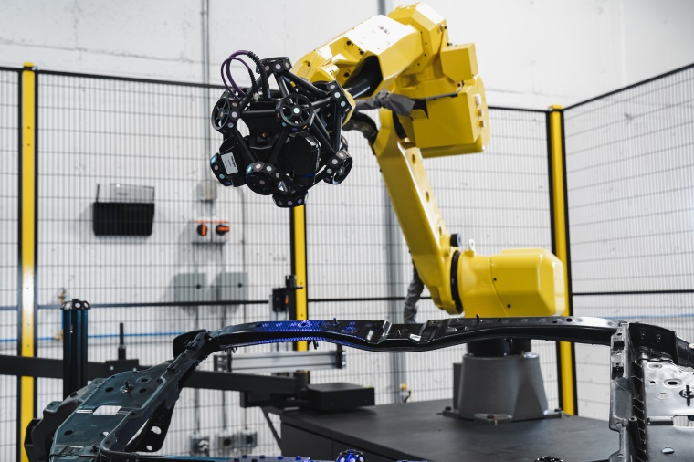 Robot-guided optical CMM scanner during quality control of a chassis. (Image:...