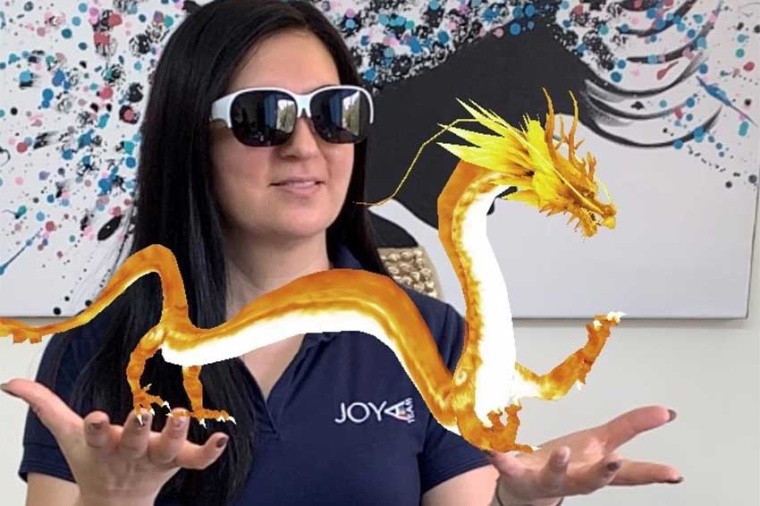 First author Olga Resnik is using augmented reality glasses to play with her...