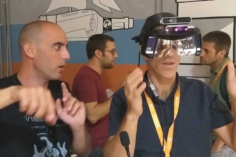Co-author Yosi Arazi trying on and evaluating an AR system performances at the...