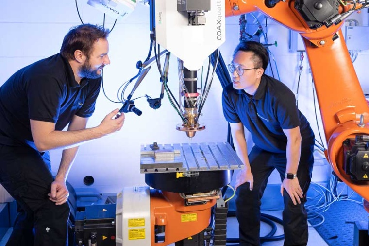 A laser beam runs through the center of the nozzle, around which up to eight...
