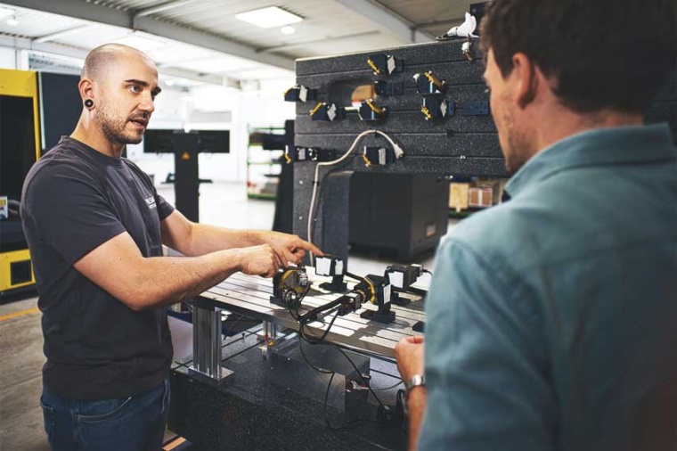 David Pallasch (left) discussing details of the beam alignment module (BAM) and...