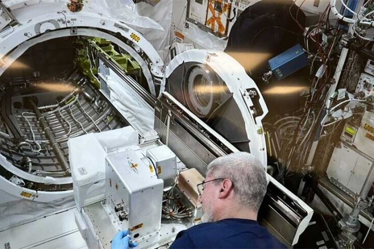 Astronaut on the International Space Station ISS assembling the components...