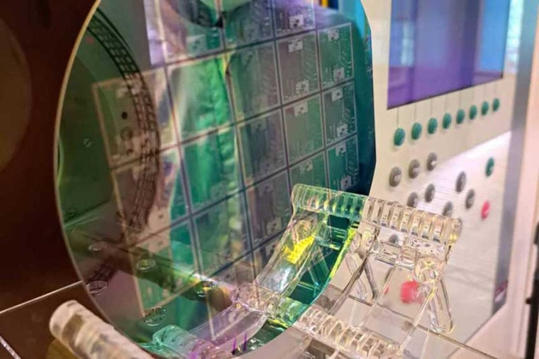 Wafers with multiple, integrated, nanophotonic chips are necessary to develop a...