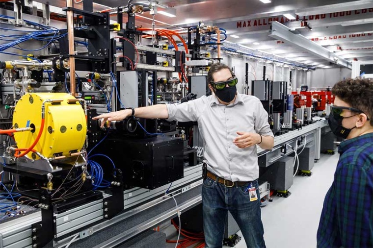 Assistant professor Samuel Teitelbaum stands by the newly commissioned...