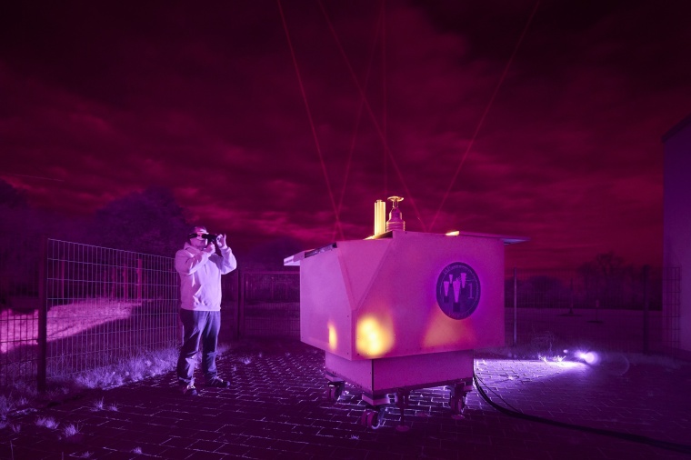The mobile lidar system sends five beams into the night sky. With four small...