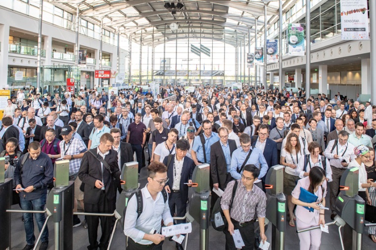Visitors crowd at the Messe Munich West Entrance for Laser World of Photonics....