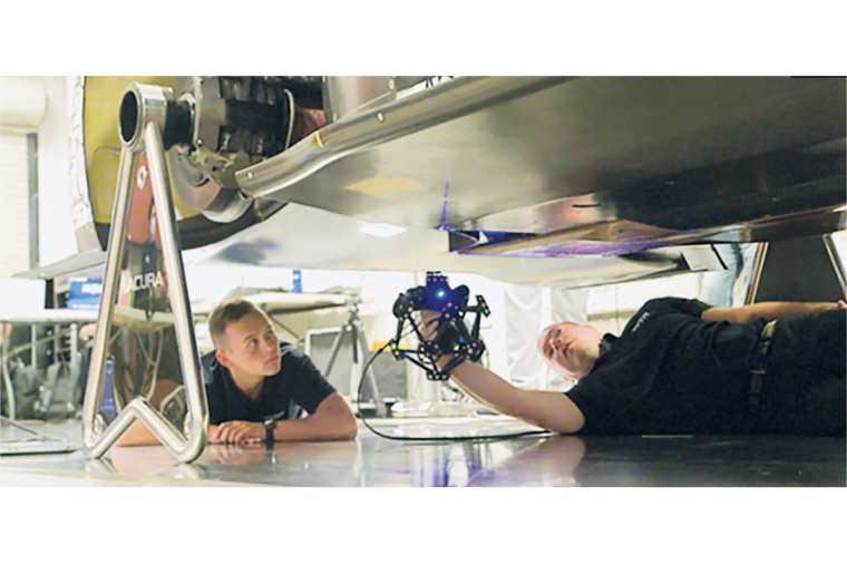 WTR Andretti engineers scanning the underbody of the race car No. 10 Konica...