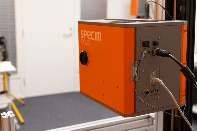 The Specim FX120 LWIR hyperspectral camera mounted on the 100 × 50 Lab Scanner...
