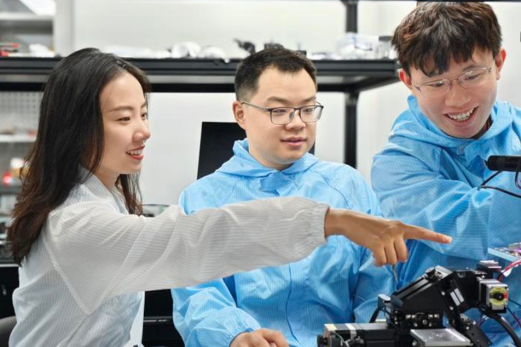 Research team leader Lu Fang, team members Tian Kuang Zhou and Wei Wu are...