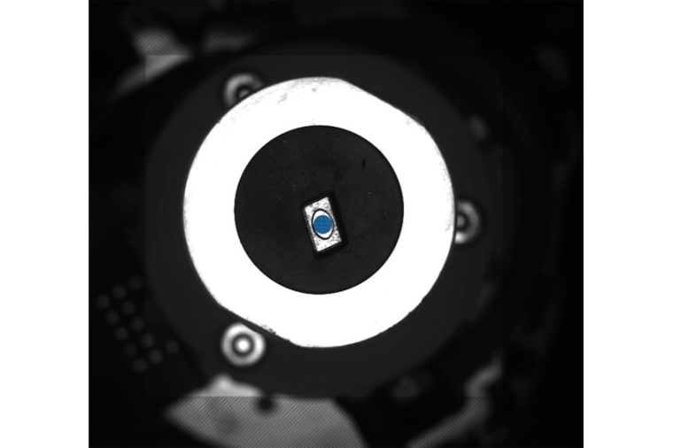 Detection of the component center from below for position correction before...