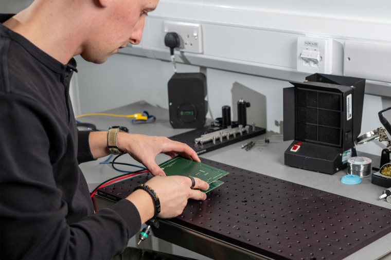 An engineer during assembly (Source: Singular Photonics)