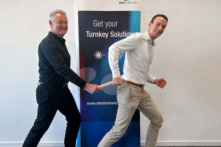 Baton handover from Klaus Maier to Michael Lee (Source: AMS Technologies)