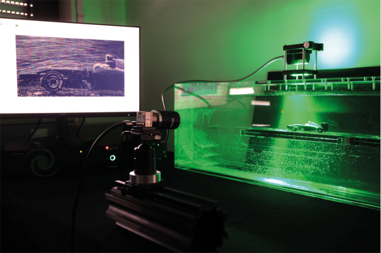 Experimental setup with flow channel, flow model, illumination source, control...