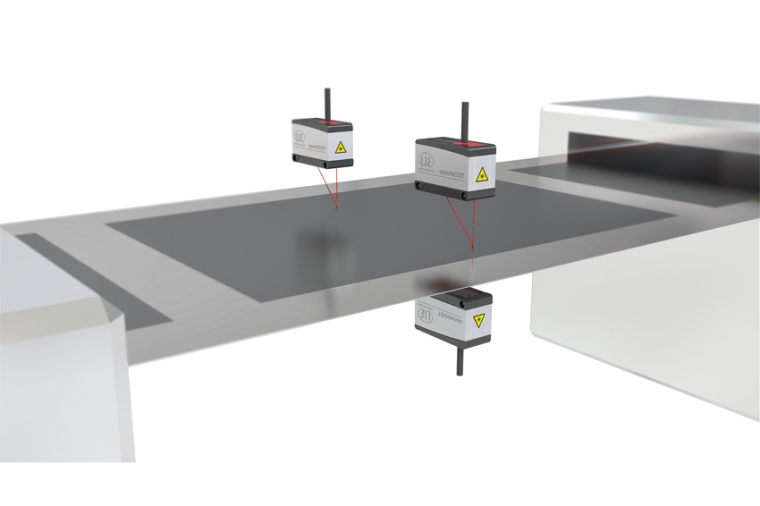 Laser distance sensors arranged opposite each other detect the thickness of...