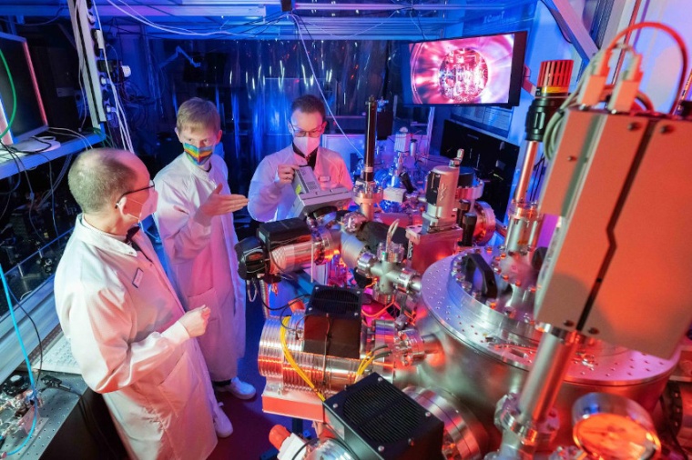 Gerhard Paulus, PhD student Felix Wiesner and Silvio Fuchs in a laser lab of...