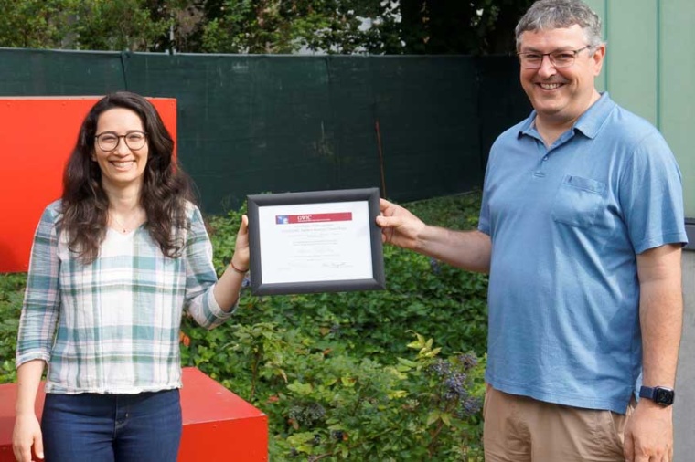 Marina Trad Nery receives the certificate for the 2020 GWIC-Braccini Thesis...