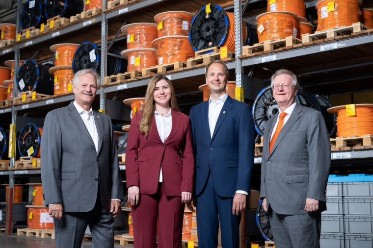 Siegbert (far right) and Andreas (far left) Lapp retire. The new chairman of...
