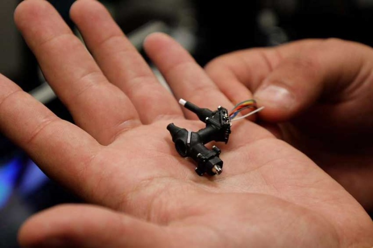 A current version of the “miniscope” developed by UCLA researchers....