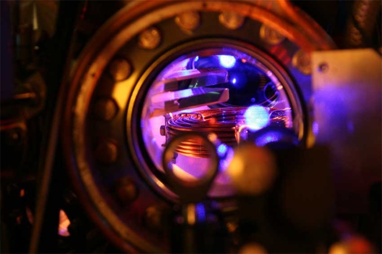 Blue fluorescing cloud of atoms that have been laser-cooled to milli-Kelvin...
