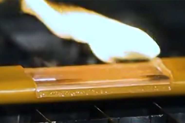 The ablation of a busbar coating with a Luxinar CO₂ laser. For a video,...