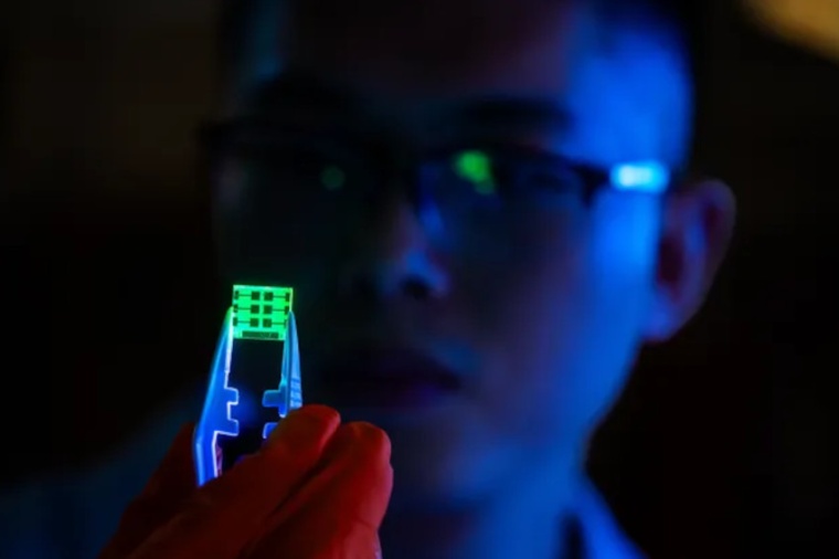 Researcher Muyi Zhang from the Linköping University holds a perovskite LED....